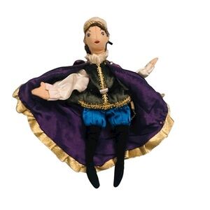 Elegant Purple and Gold Doll with Blue Outfit